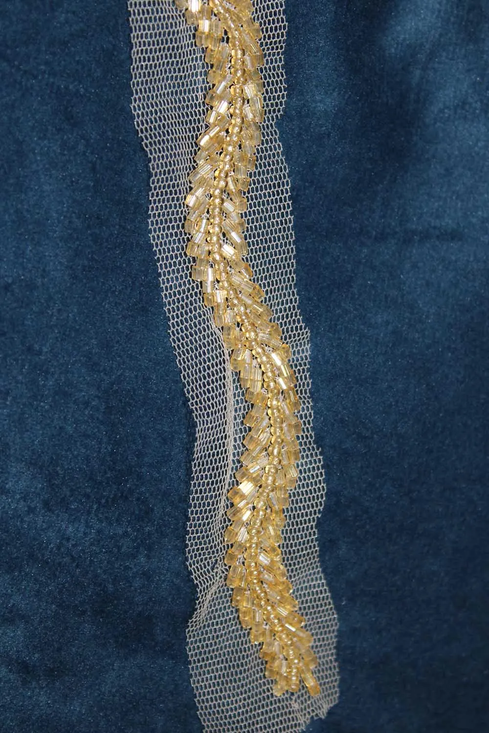 Gilded Elegance: Opulent Handcrafted Lace with Golden Embellishments
